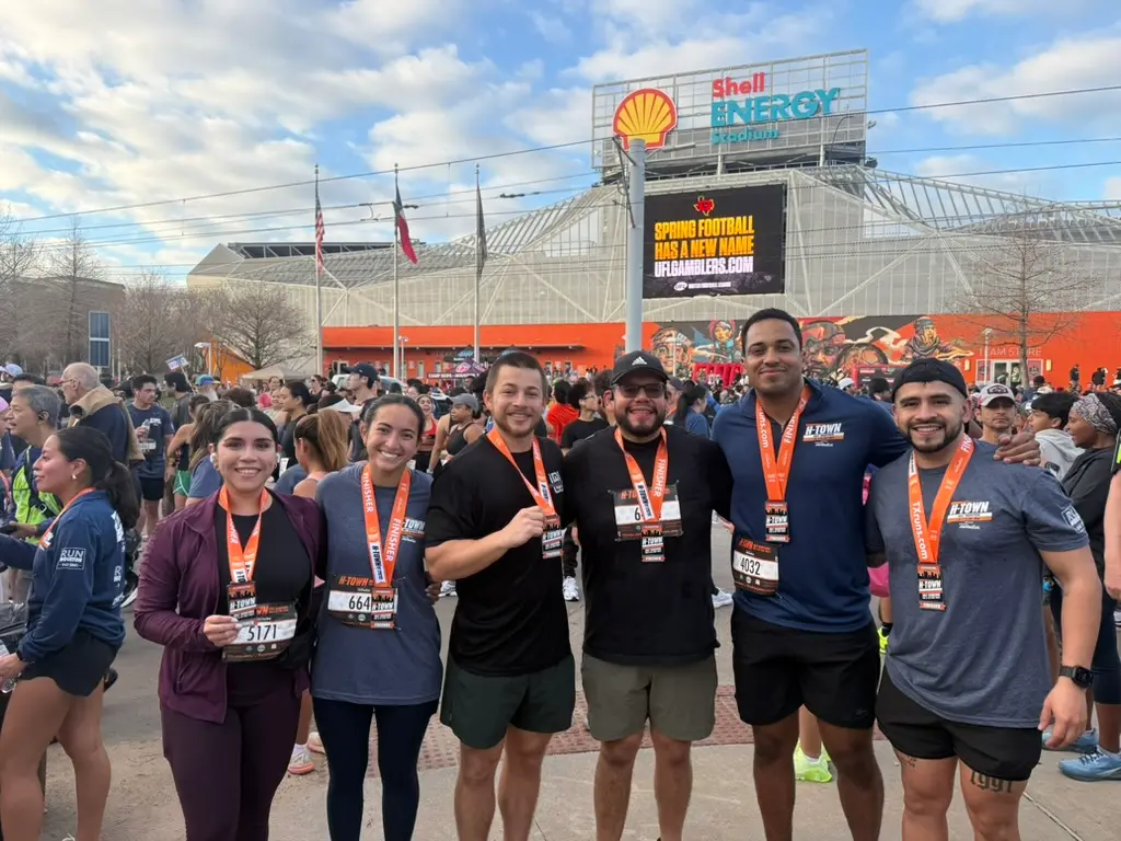 Black Wolf crew with race medals in downtown Houston